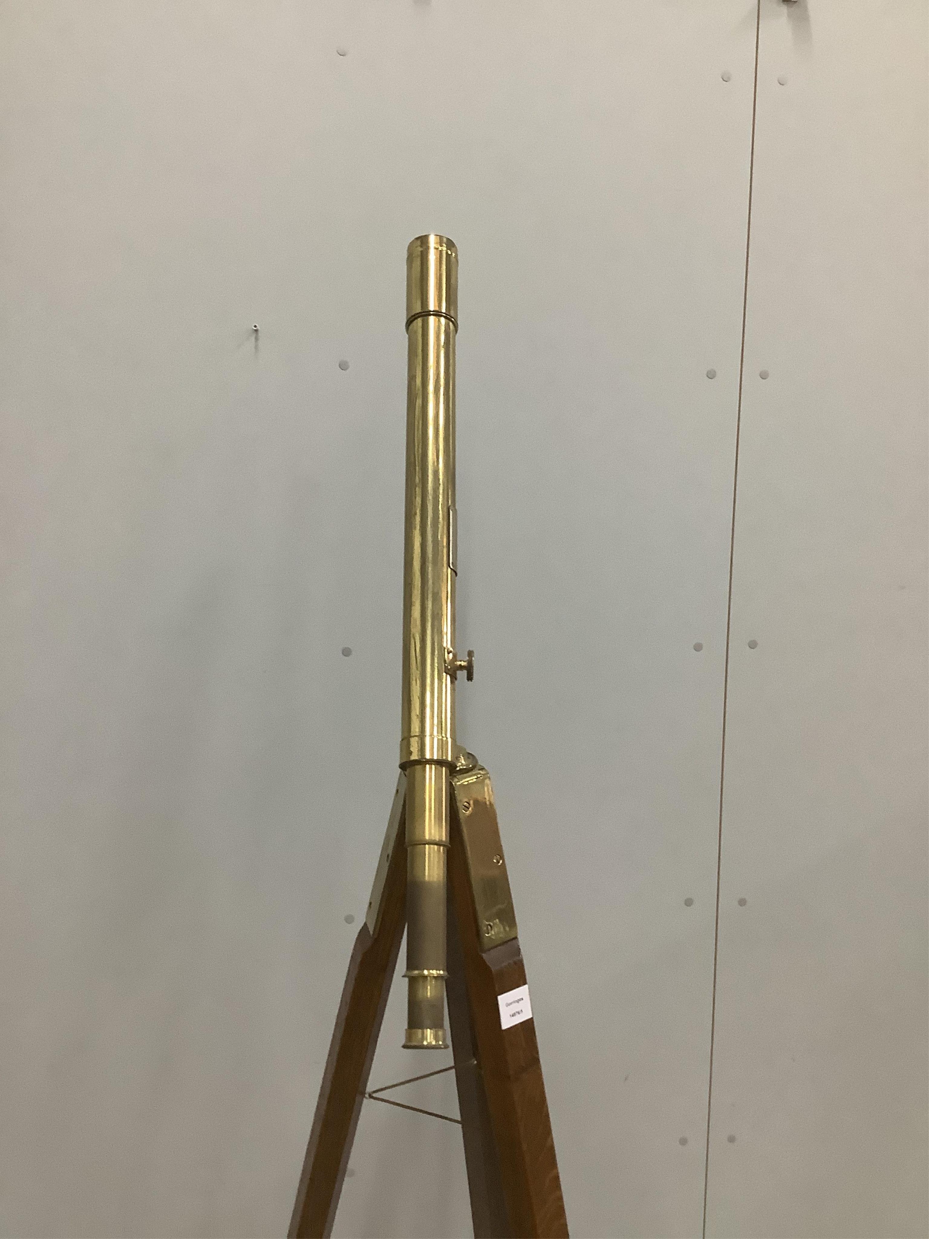 A late 19th century brass two draw telescope, by J. H. Steward, on oak tripod stand, 56cm. Condition - fair, some parts seized